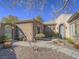 Beautiful home with desert landscaping, gated courtyard, and a charming exterior with stucco finishes at 10446 Abbotsbury Dr, Las Vegas, NV 89135