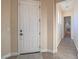 Welcoming front door leading to a bright hallway with tile flooring and easy access to other rooms at 10446 Abbotsbury Dr, Las Vegas, NV 89135