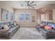 Comfortable living room featuring neutral paint, recessed lighting, and abundant natural light from plantation shutters at 10446 Abbotsbury Dr, Las Vegas, NV 89135