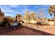 Expansive backyard with a patio, seating area, landscaping, and mountain views at 10528 Cogswell Ave, Las Vegas, NV 89134