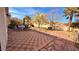 Spacious backyard with patio, seating area, landscaping, and mountain views at 10528 Cogswell Ave, Las Vegas, NV 89134