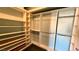 Spacious walk-in closet with custom shelving and ample storage space for organization at 10528 Cogswell Ave, Las Vegas, NV 89134