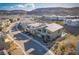 Birds eye view of a new residential neighborhood nestled in a scenic mountain landscape at 10632 Patina Hills Ct, Las Vegas, NV 89135