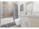 Well-lit bathroom featuring a tub/shower combination and a modern vanity at 10632 Patina Hills Ct, Las Vegas, NV 89135