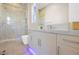 Modern bathroom featuring a glass shower and a sleek vanity with ample storage at 10632 Patina Hills Ct, Las Vegas, NV 89135