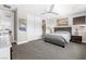 Bedroom with a large gray bed, neutral decor, and ample closet space at 10632 Patina Hills Ct, Las Vegas, NV 89135