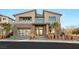 Beautifully landscaped modern two-story home with a spacious garage and elegant entrance at 10632 Patina Hills Ct, Las Vegas, NV 89135