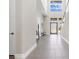 Bright, modern foyer with natural light, high ceilings, and sleek tile flooring creates a welcoming entrance at 10632 Patina Hills Ct, Las Vegas, NV 89135