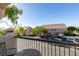 Balcony view of neighborhood street, showcasing nearby townhomes and well-maintained landscaping at 1092 Slate Crossing Ln # 1, Henderson, NV 89002