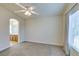 Bedroom with neutral carpet and sight lines to the en-suite bathroom at 1092 Slate Crossing Ln # 1, Henderson, NV 89002