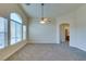 Bright living room with lots of natural light and ceiling fan, and neutral colored carpet at 1092 Slate Crossing Ln # 1, Henderson, NV 89002