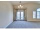 Bright living room featuring plush carpet, neutral tones, and ample natural light at 1092 Slate Crossing Ln # 1, Henderson, NV 89002