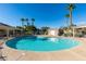 Sparkling community pool surrounded by palm trees and comfortable seating areas at 1092 Slate Crossing Ln # 1, Henderson, NV 89002