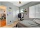 Bedroom with a ceiling fan, closet, and a window that provides natural light at 1209 Padre Serra Ln, Las Vegas, NV 89134