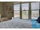 Bedroom with three large windows offering great natural light and views of mountains at 1209 Padre Serra Ln, Las Vegas, NV 89134