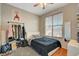 Bedroom features a window with blinds, wood floors, and shelving for décor and storage at 1209 Padre Serra Ln, Las Vegas, NV 89134