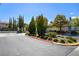 Community entrance gate with lush landscaping and decorative features at 1209 Padre Serra Ln, Las Vegas, NV 89134