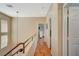 Hallway with views to the rooms, wood floor, and natural light at 1209 Padre Serra Ln, Las Vegas, NV 89134