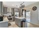 Kitchen featuring stainless steel appliances, an island with seating, and natural light at 1209 Padre Serra Ln, Las Vegas, NV 89134