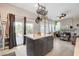 Kitchen island with seating and access to the outdoor patio, perfect for entertaining at 1209 Padre Serra Ln, Las Vegas, NV 89134