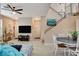 Open floorplan view of the living room and staircase, and adjacent dining area at 1209 Padre Serra Ln, Las Vegas, NV 89134