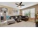 Cozy living room with a large sectional sofa, and bright windows at 1209 Padre Serra Ln, Las Vegas, NV 89134