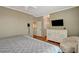 Main bedroom features wood floors, dresser, TV, and closet at 1209 Padre Serra Ln, Las Vegas, NV 89134