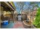 Backyard patio features an outdoor kitchen with stainless steel grill and brick flooring at 1209 Padre Serra Ln, Las Vegas, NV 89134