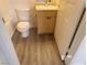 This bathroom features a toilet and vanity with sink and cabinet storage at 1401 N Michael Way # 239, Las Vegas, NV 89108