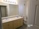 Bathroom with double sinks, large mirror, updated lighting, and new flooring at 1401 N Michael Way # 239, Las Vegas, NV 89108