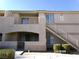 Exterior view of the building with balconies, stairs and desert landscaping at 1401 N Michael Way # 239, Las Vegas, NV 89108