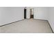 Expansive carpeted bedroom, white walls, and bathroom entrance at 1405 Vegas Valley Dr # 286, Las Vegas, NV 89169