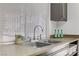 A close up of the kitchen sink with modern faucet and white blinds allowing for natural light to filter in at 1405 Vegas Valley Dr # 286, Las Vegas, NV 89169