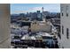 Daytime view of the Las Vegas cityscape with commercial buildings, city streets, and a glimpse of mountains at 150 Las Vegas Blvd # 1608, Las Vegas, NV 89101