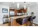 Modern kitchen featuring a granite countertop bar with leather barstools and stainless steel appliances at 150 Las Vegas Blvd # 1608, Las Vegas, NV 89101