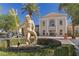 Beautiful clubhouse entrance with stately statue in landscaped setting at 16 Via Visione # 101, Henderson, NV 89011