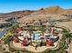 Aerial view of luxury estate boasts a stunning pool, cabanas and mountain views at 16 Via Visione # 101, Henderson, NV 89011