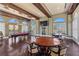 Spacious game room featuring a pool table, seating, and natural light from large windows at 16 Via Visione # 101, Henderson, NV 89011