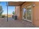 Covered patio with dual AC Units, stone flooring and views of the desert landscape at 16 Via Visione # 101, Henderson, NV 89011