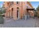 Outdoor patio with dual AC Units, stone flooring, desert views and stone tile at 16 Via Visione # 101, Henderson, NV 89011