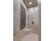 Beautifully tiled walk in shower with built in bench at 16 Via Visione # 101, Henderson, NV 89011