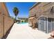 Wide-angle view of the private backyard with pool, shed, and mature trees at 1754 Quiver Point Ave, Henderson, NV 89012