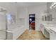 Bright bathroom featuring a soaking tub, glass shower, double sink vanity, and tiled flooring at 1754 Quiver Point Ave, Henderson, NV 89012