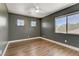 Cozy bedroom with wood floors and large windows, offering ample natural light at 1754 Quiver Point Ave, Henderson, NV 89012