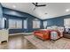 Bedroom with a decorative rug, vaulted ceiling, and large windows at 1754 Quiver Point Ave, Henderson, NV 89012