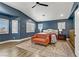 Beautiful bedroom with a decorative rug, and large windows with shutter-style shades at 1754 Quiver Point Ave, Henderson, NV 89012