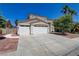 Charming two-story home with well-manicured lawn and three-car garage at 1754 Quiver Point Ave, Henderson, NV 89012