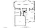 Detailed first floor plan showing the layout of the kitchen, living room, bedroom, and garage at 1754 Quiver Point Ave, Henderson, NV 89012