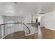 Open hallway with elegant hardwood floors, modern lighting, and iron stair railings at 1754 Quiver Point Ave, Henderson, NV 89012