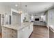 Open concept kitchen with granite island flowing into the living room, great for entertaining at 1754 Quiver Point Ave, Henderson, NV 89012